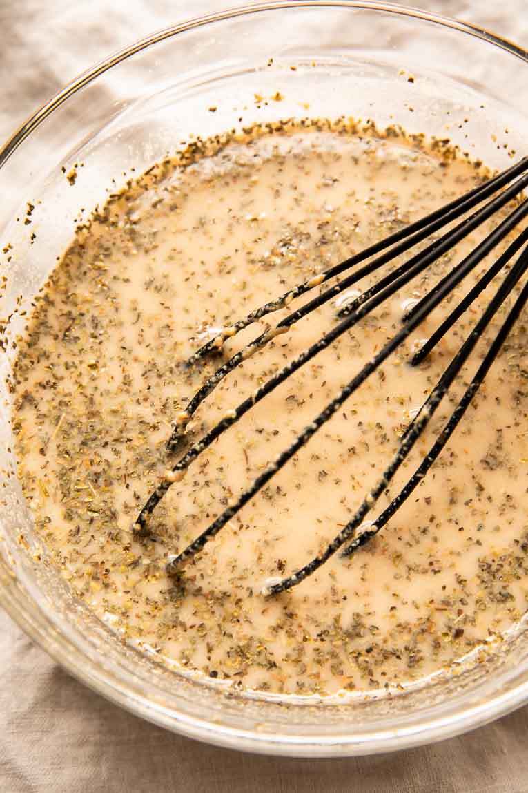 Dairy free creamy sauce being whisked together.