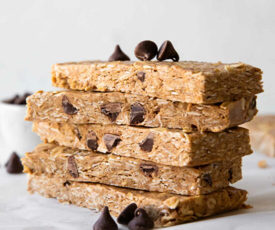 No-Bake Oatmeal Protein Bars stacked on parchment paper.