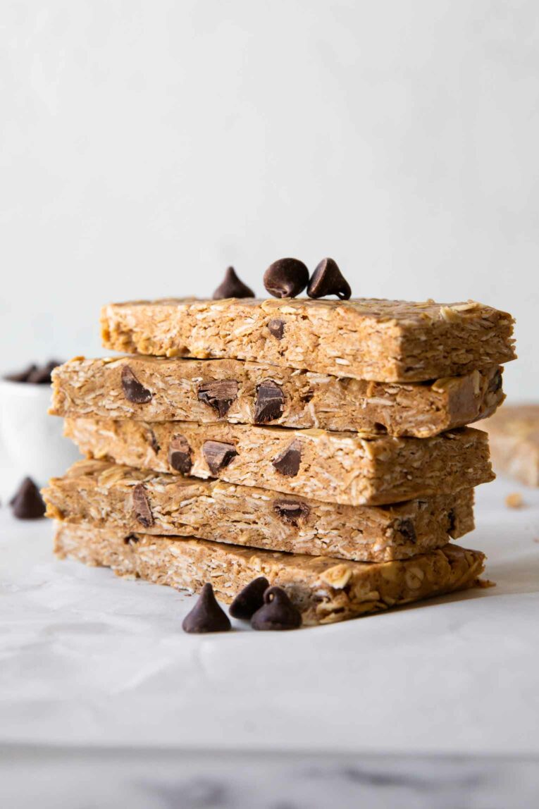 No-Bake Oatmeal Protein Bars stacked on parchment paper.