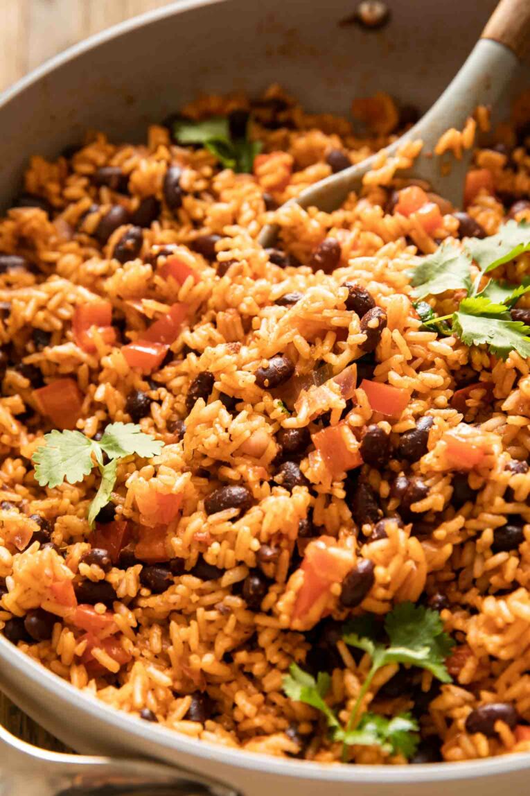 Angled photo of Spanish Rice & Beans in a pan.