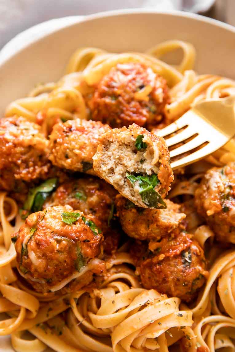 Baked spinach chicken meatball cut in half.