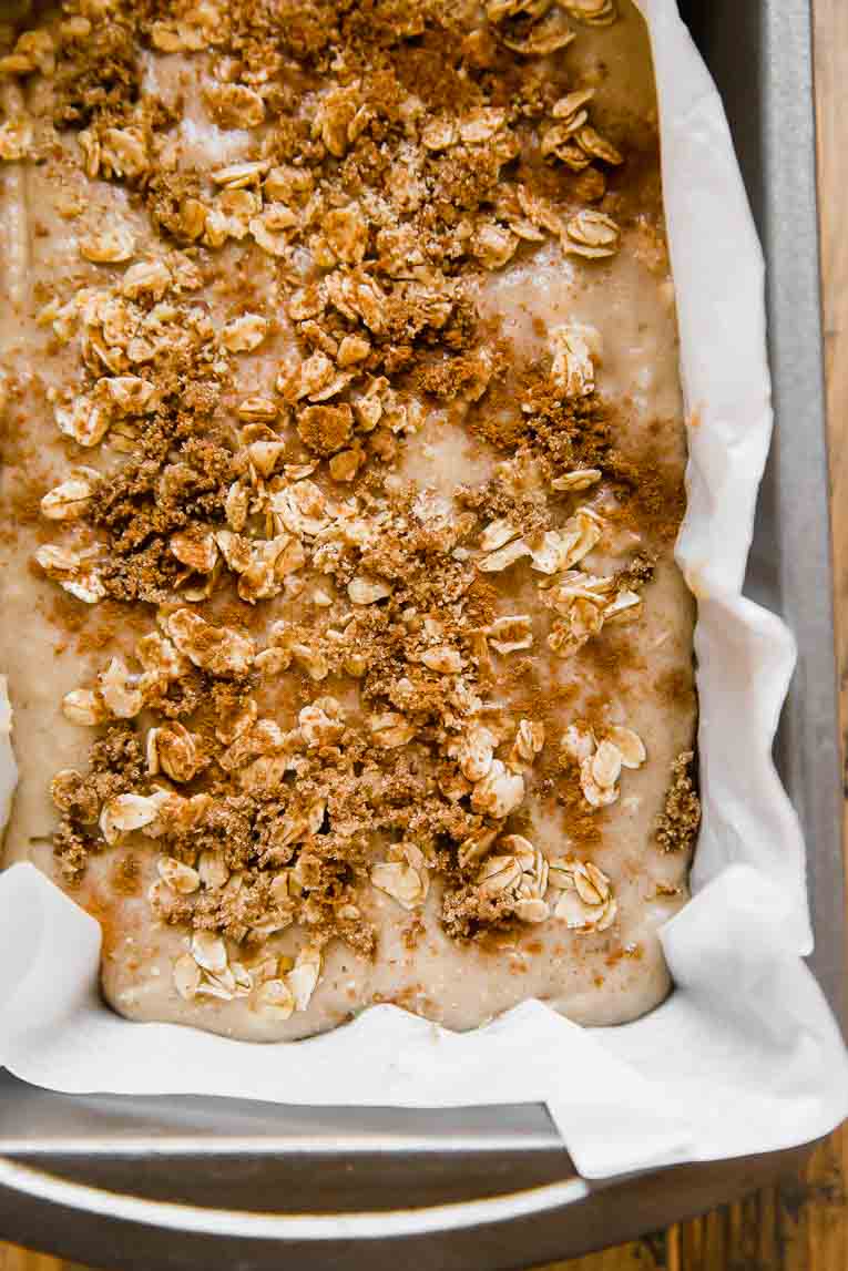 Banana bread batter poured into a loaf pan.