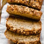 Healthy banana bread slices on a cutting board.