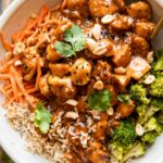 Top photo of peanut butter chicken recipe in a large bowl.
