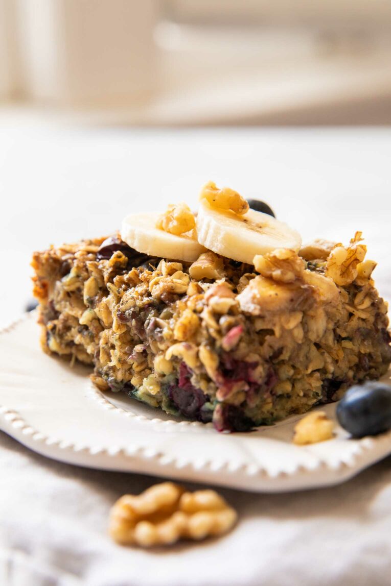 Close up of baked oatmeal bar with blueberries and bananas.