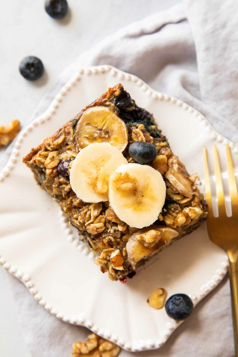 Blueberry banana baked oatmeal bar on a plate.