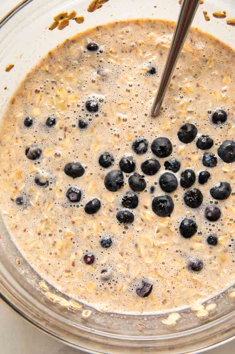 Blueberry banana baked oatmeal batter being mixed together.