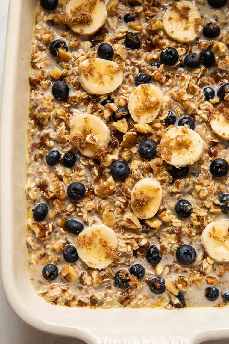 Blueberry banana oats in a casserole dish before baking.