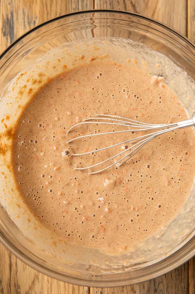 Carrot cake pancake batter being mixed together.
