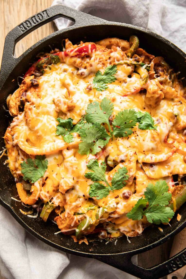 Chicken fajita casserole recipe in a cast iron skillet.