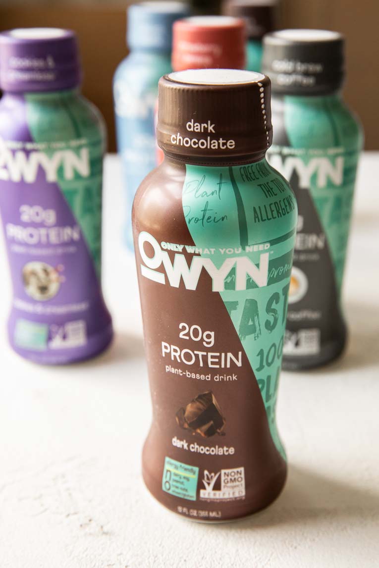 Across photo of OWYN 20g protein shakes.