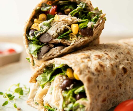 Close up of Fiesta Ranch Chicken Wraps stacked on each other.