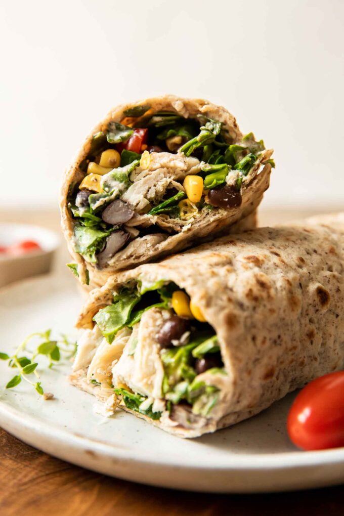 Close up of Fiesta Ranch Chicken Wraps stacked on each other.