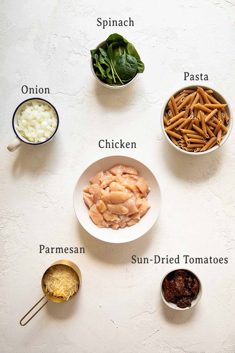 Ingredients for sun-dried tomato chicken pasta.