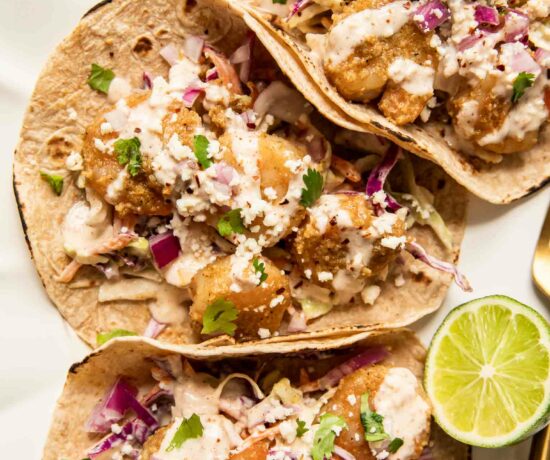 Baja Shrimp Tacos Recipe with limes on a plate.