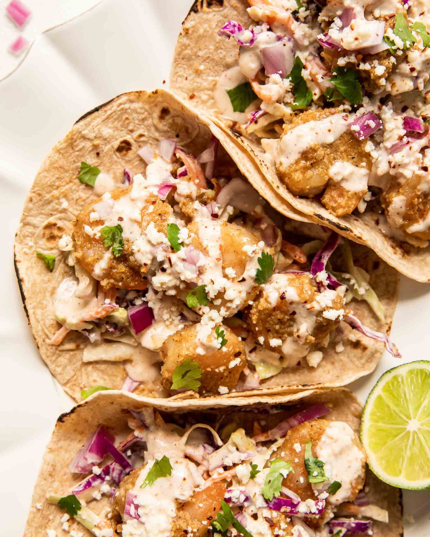 Baja Shrimp Tacos Recipe with cabbage coleslaw and lime.