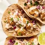 Baja Shrimp Tacos Recipe with cabbage coleslaw and lime.
