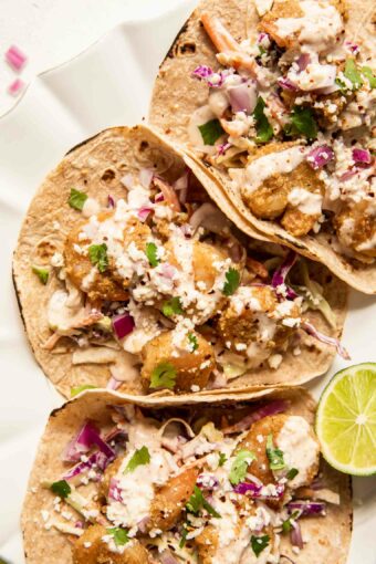 Baja Shrimp Tacos Recipe with cabbage coleslaw and lime.