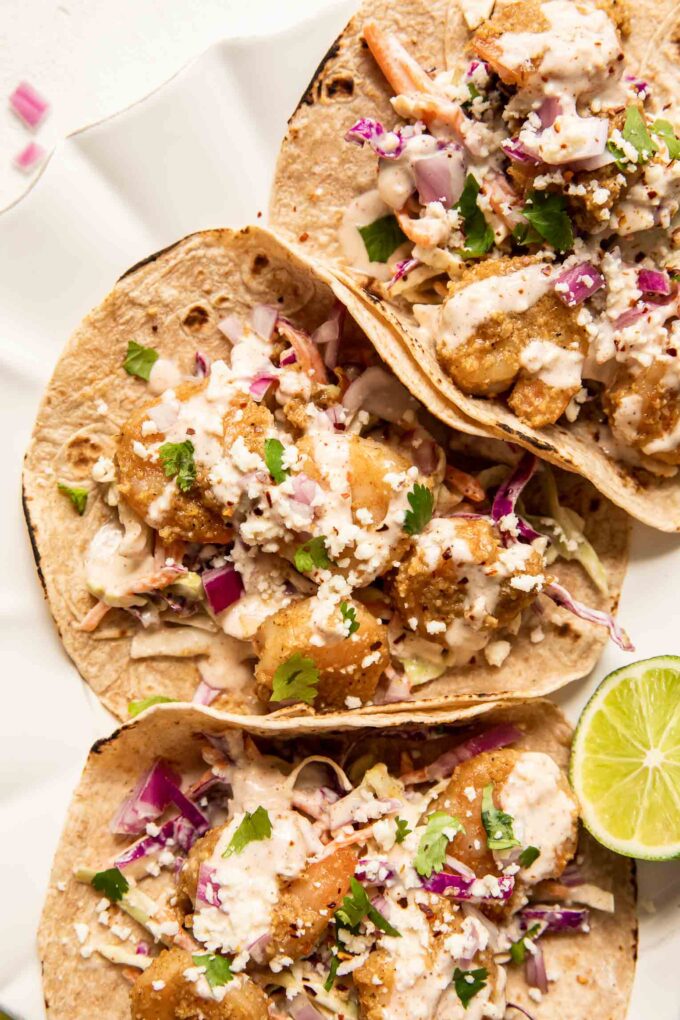 Baja Shrimp Tacos Recipe with cabbage coleslaw and lime.