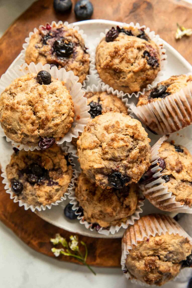 Blueberry banana protein muffins on a plate.