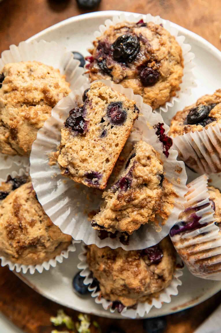 Protein muffin cut in half in a cupcake liner.