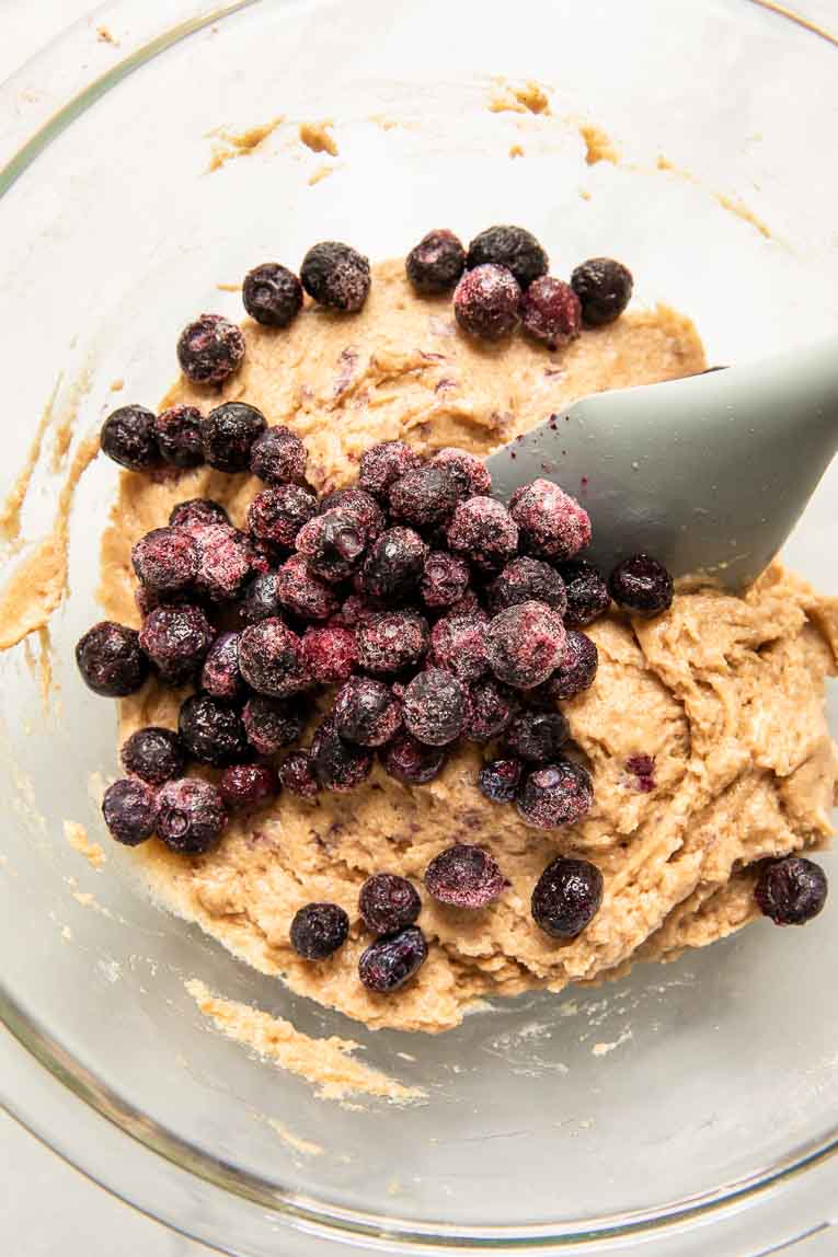 Banana protein muffin batter with blueberries.