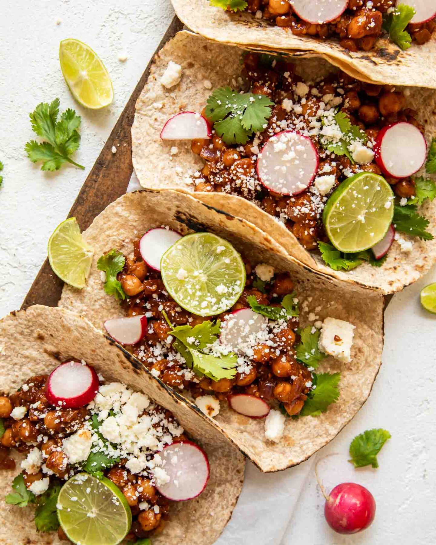 Vegan Chipotle Chickpea Tacos with lime and cilantro.