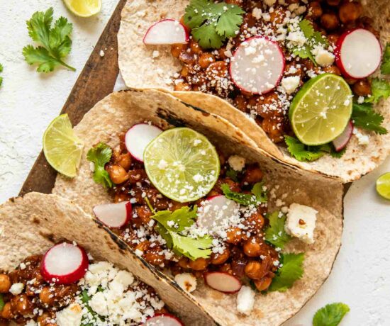 Vegan Chipotle Chickpea Tacos with lime and cilantro.