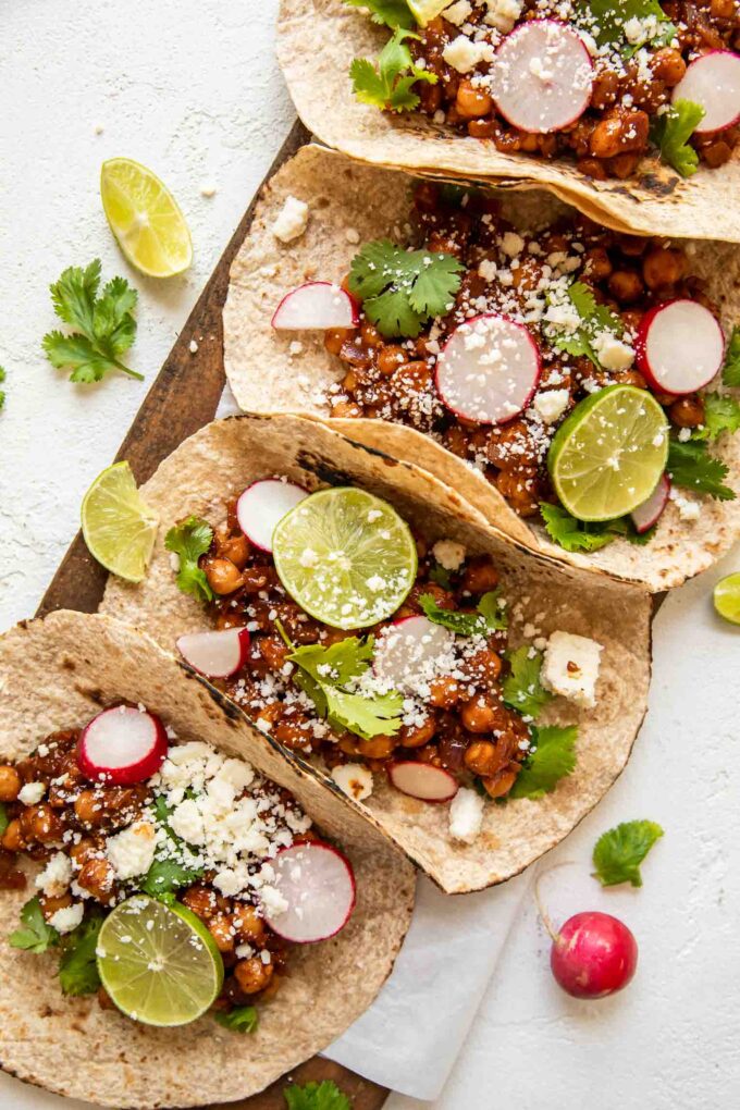 Vegan Chipotle Chickpea Tacos with lime and cilantro.