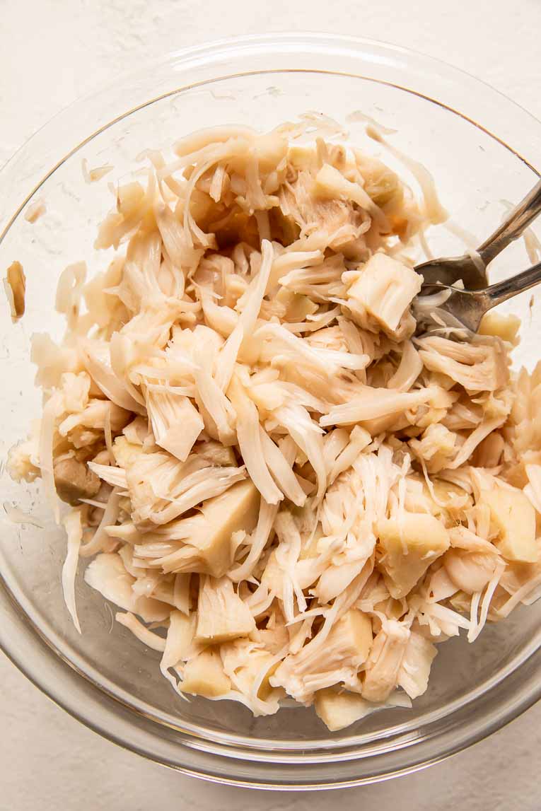 Shredded jackfruit in a mixing bowl.