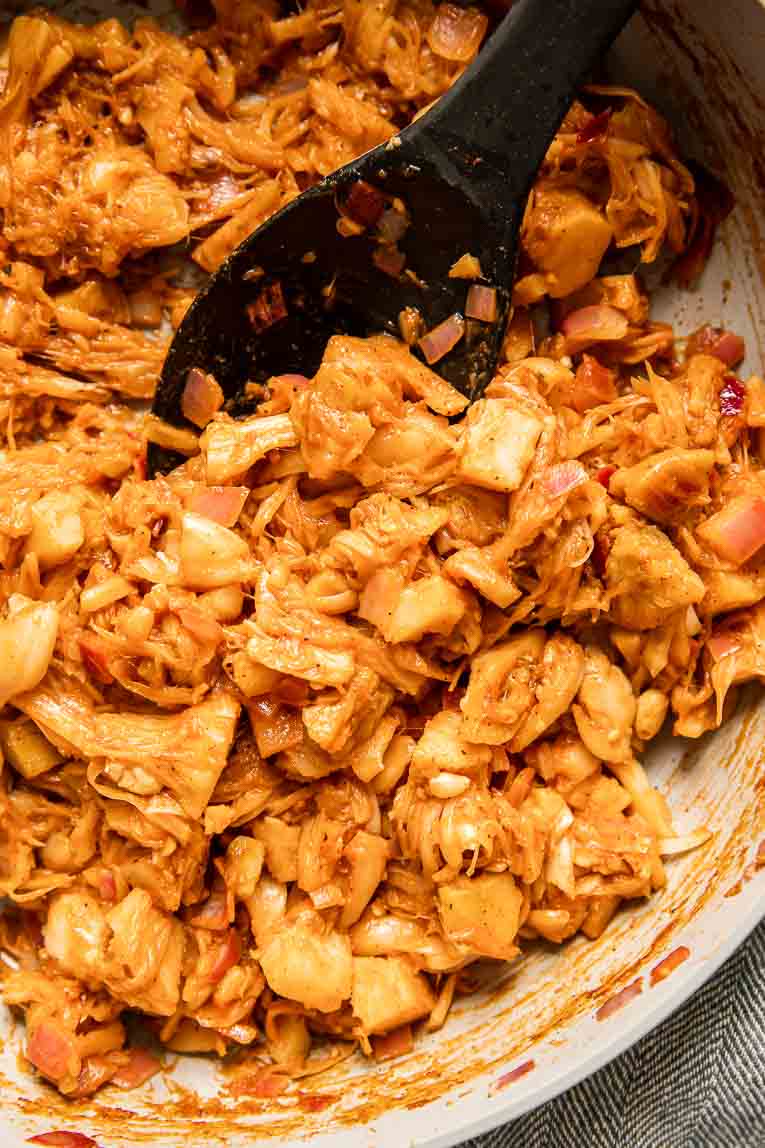 Jackfruit pulled pork being cooked in a skillet.