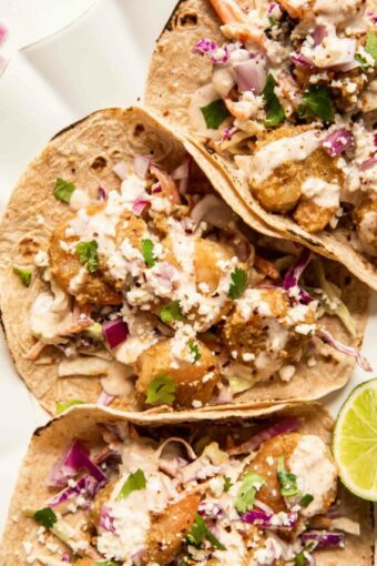 Baja Shrimp Tacos Recipe with cabbage coleslaw and lime.