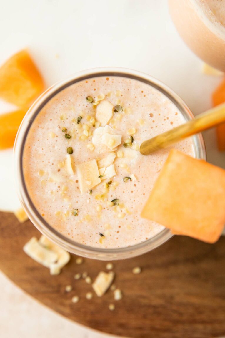 Top photo of cantaloupe smoothie in a glass.