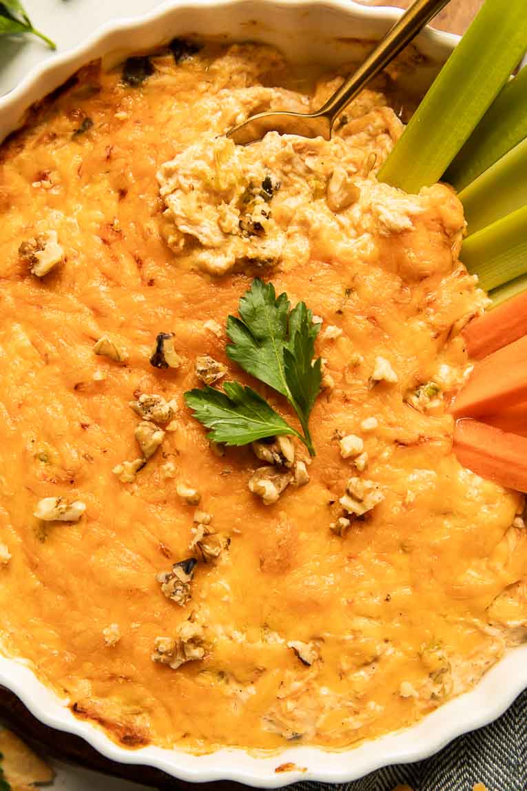 Healthy buffalo chicken dip in a casserole dish.