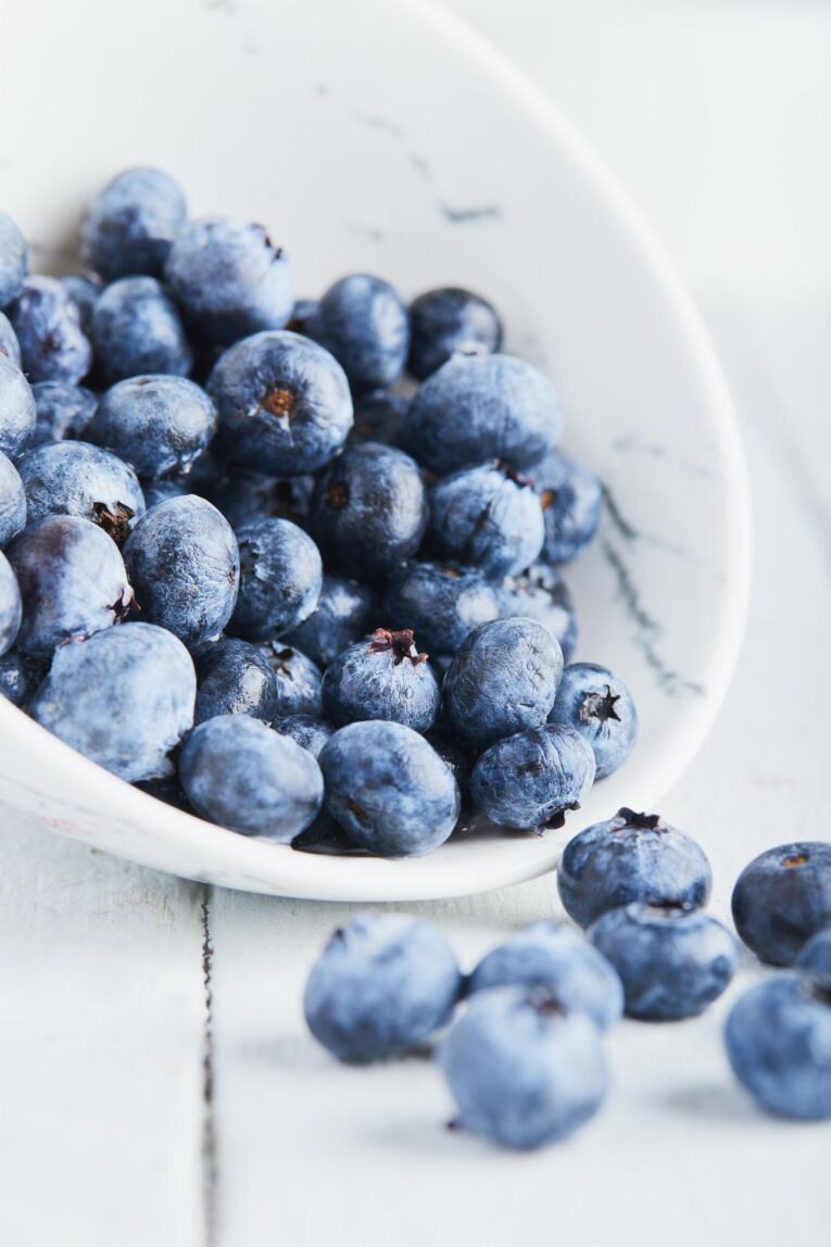 Blueberries in a white bowl.