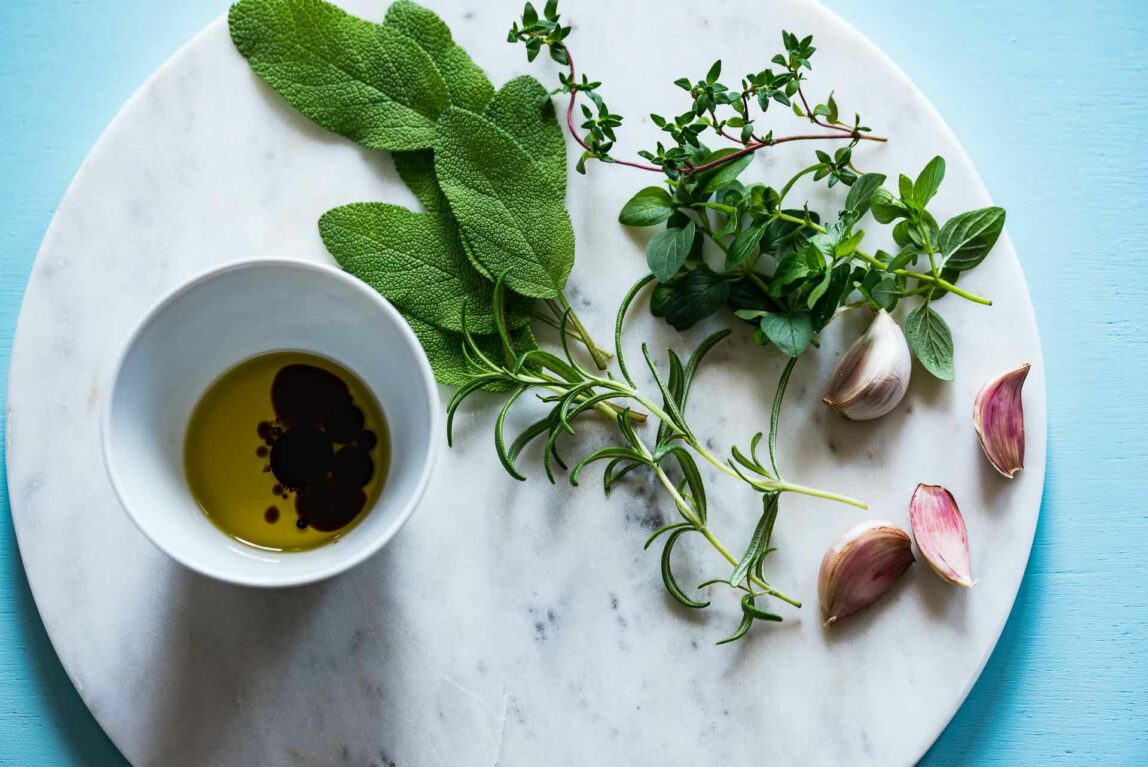 Thyme substitution herbs on a countertop.