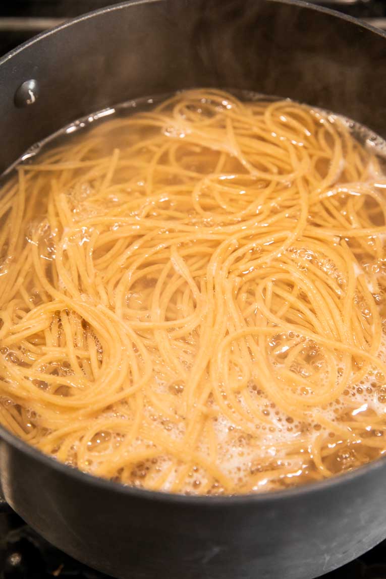 Pasta being boiled in water.