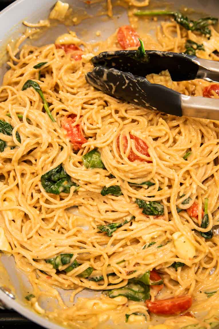 Brie pasta being cooked in a pan.