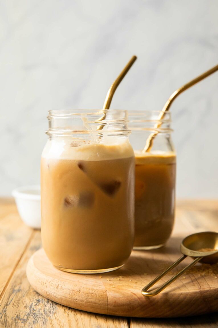 Iced coffee with protein in a jar with ice.
