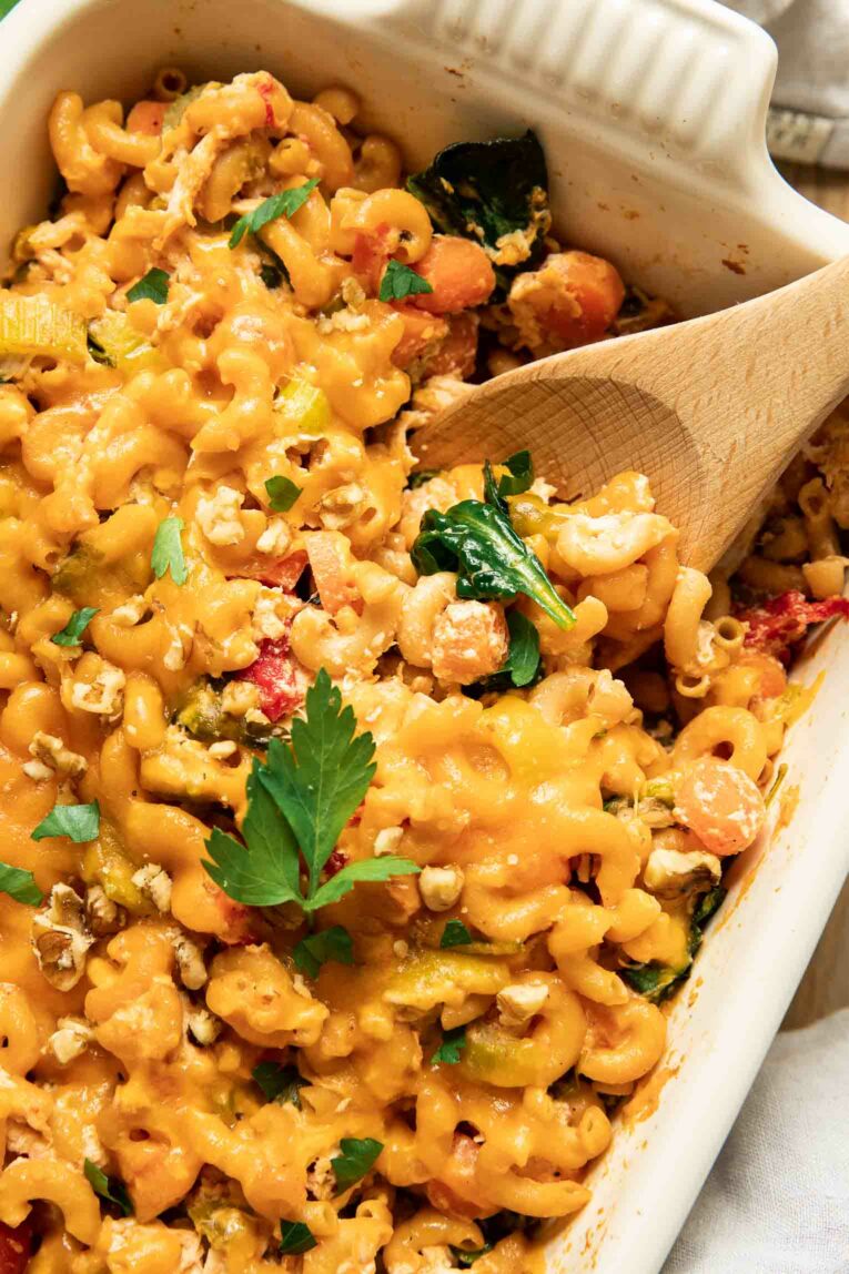 Close up of buffalo chicken pasta casserole in a baking dish.