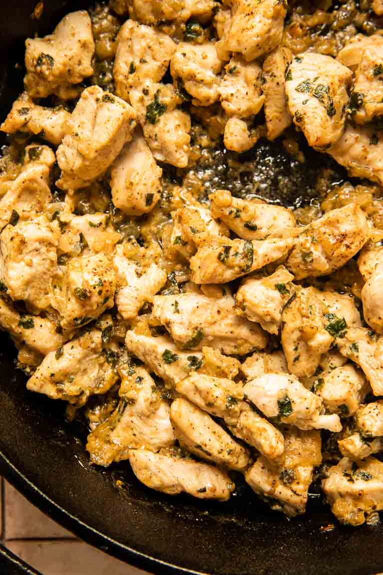 Chimichurri chicken recipe being cooked in a skillet.