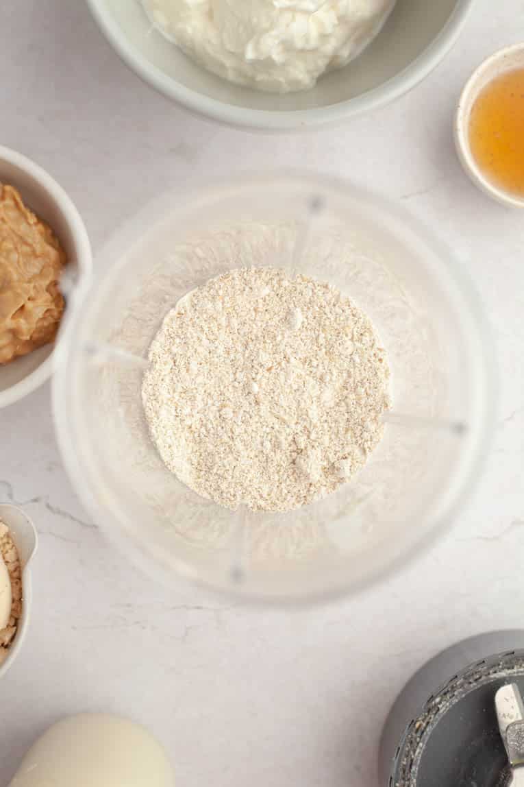 Top photo of protein powder in a bowl with smoothie ingredients.