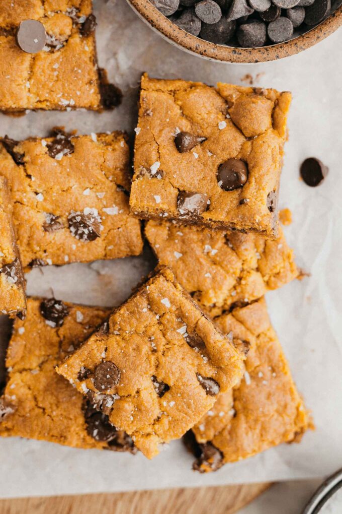 Vegan Chocolate Chip Cookie Bars on parchment paper.