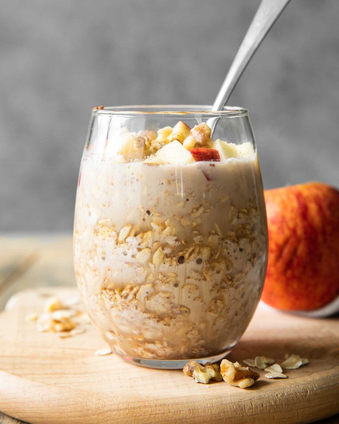 Apple Cinnamon Overnight Oats in a mason jar with a spoon.
