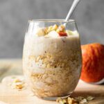 Apple Cinnamon Overnight Oats in a mason jar with a spoon.