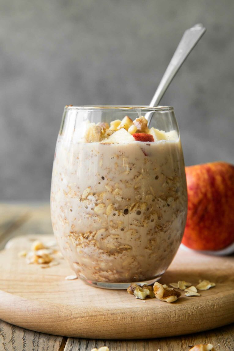 Across photo of Apple Overnight Oats in a glass.