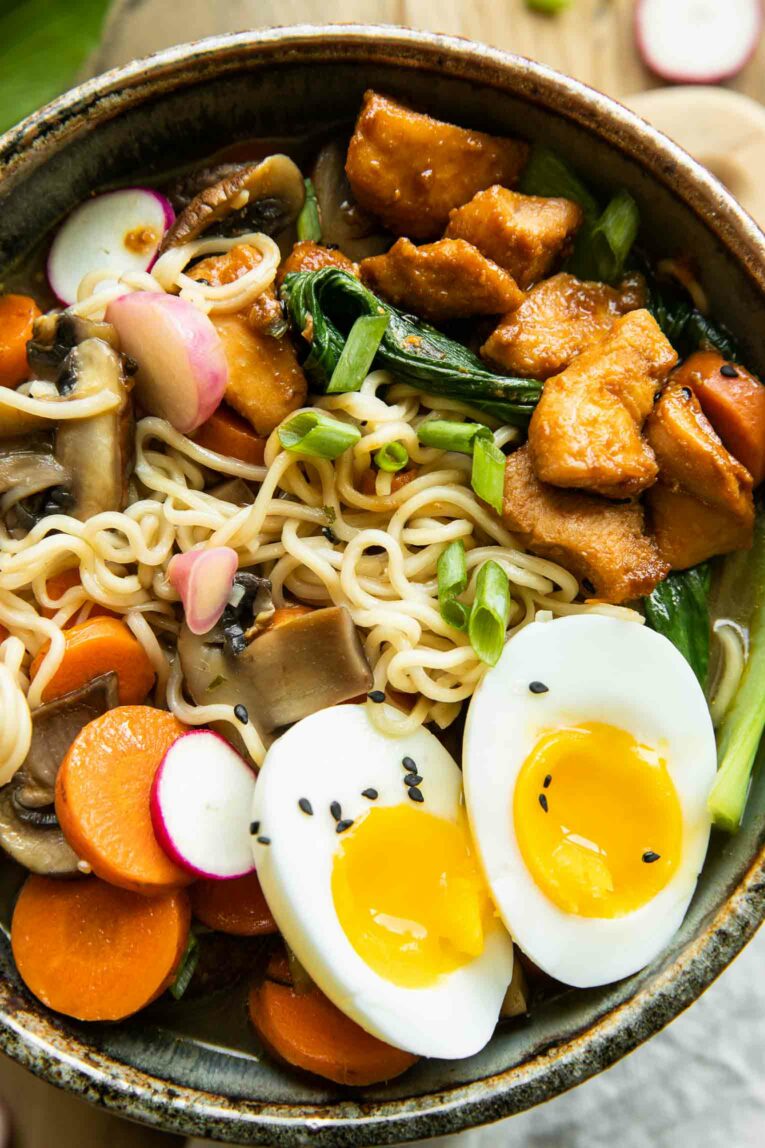Close up photo of Spicy chicken ramen with eggs.