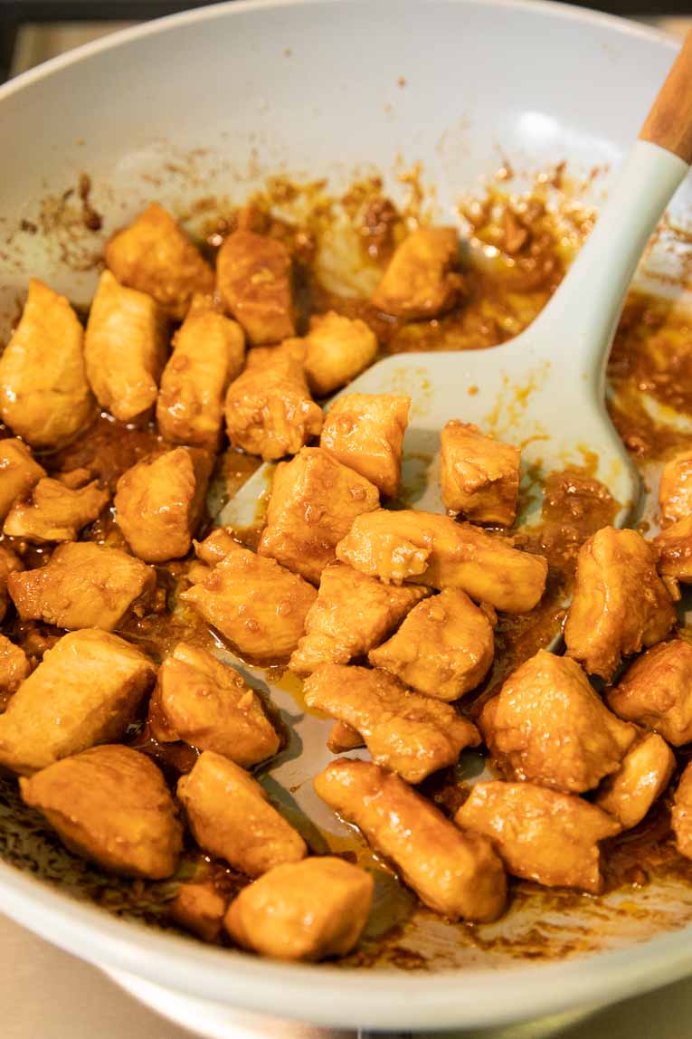 Spicy chicken recipe being cooked.