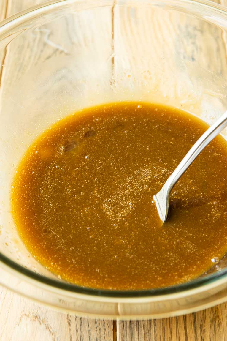 Liquid ingredients in a mixing bowl for sweet potato brownies.