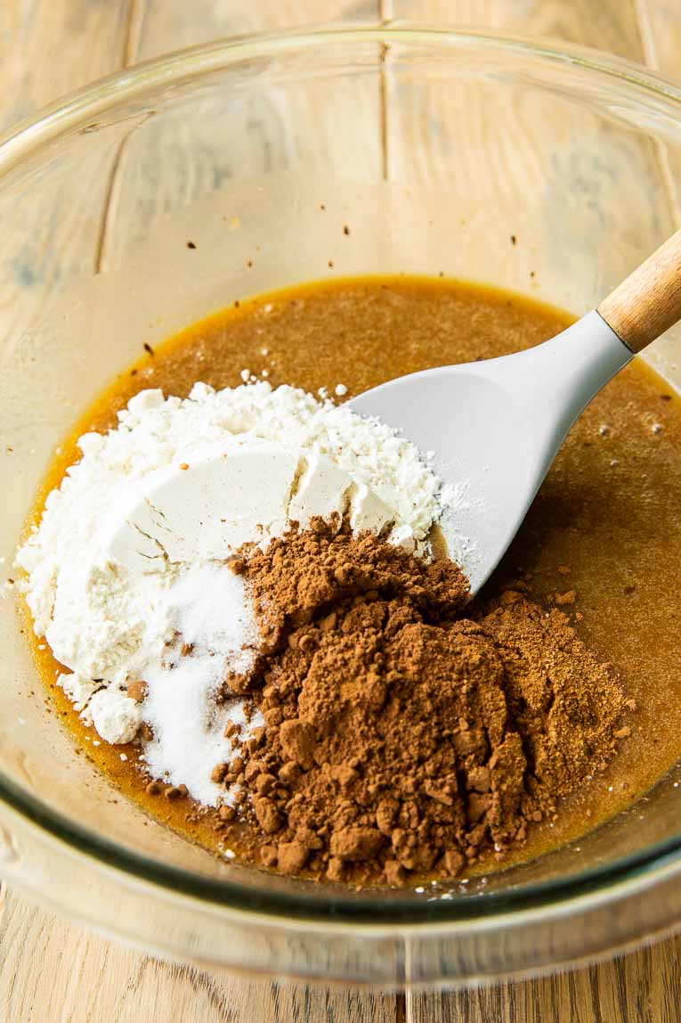 Flour and cocoa mixed with brownie batter.